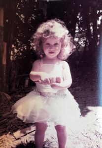 Renee as a child, dressed like a fairy
